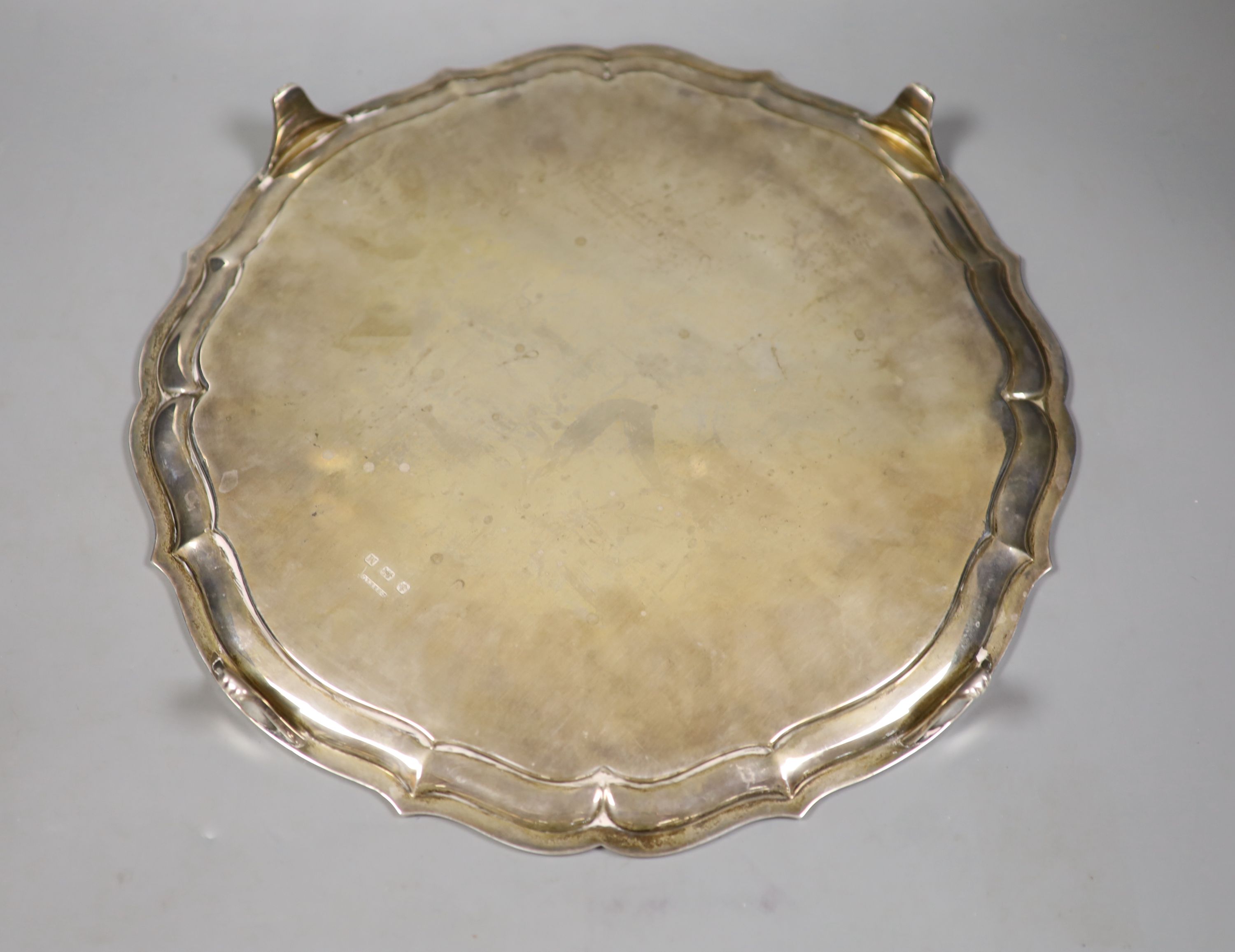 A circular silver salver